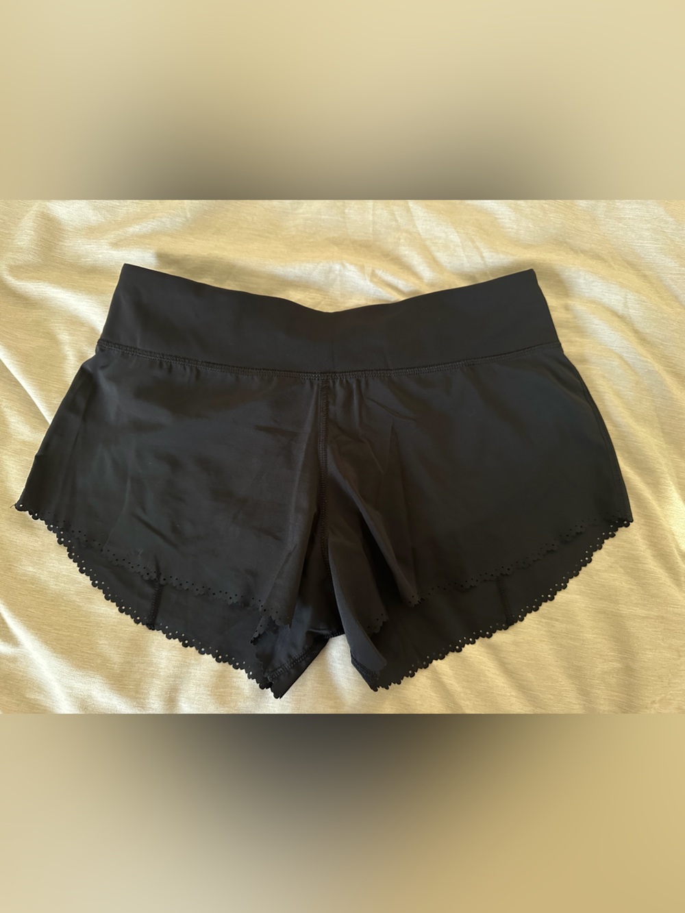 Lululemon black womens shorts size 4 liner inside laser cut design on the bottom